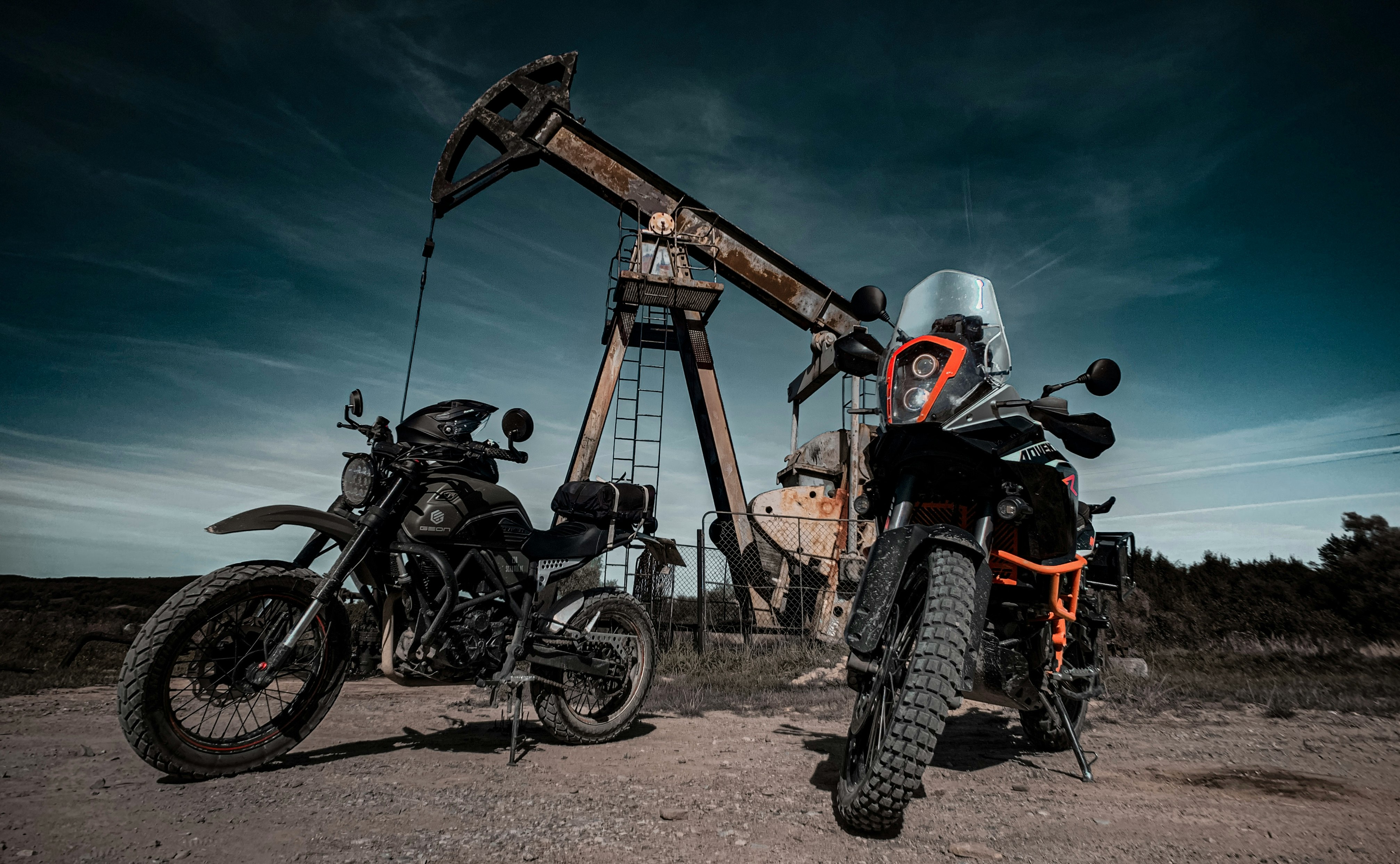 black and red motorcycle on brown dirt road